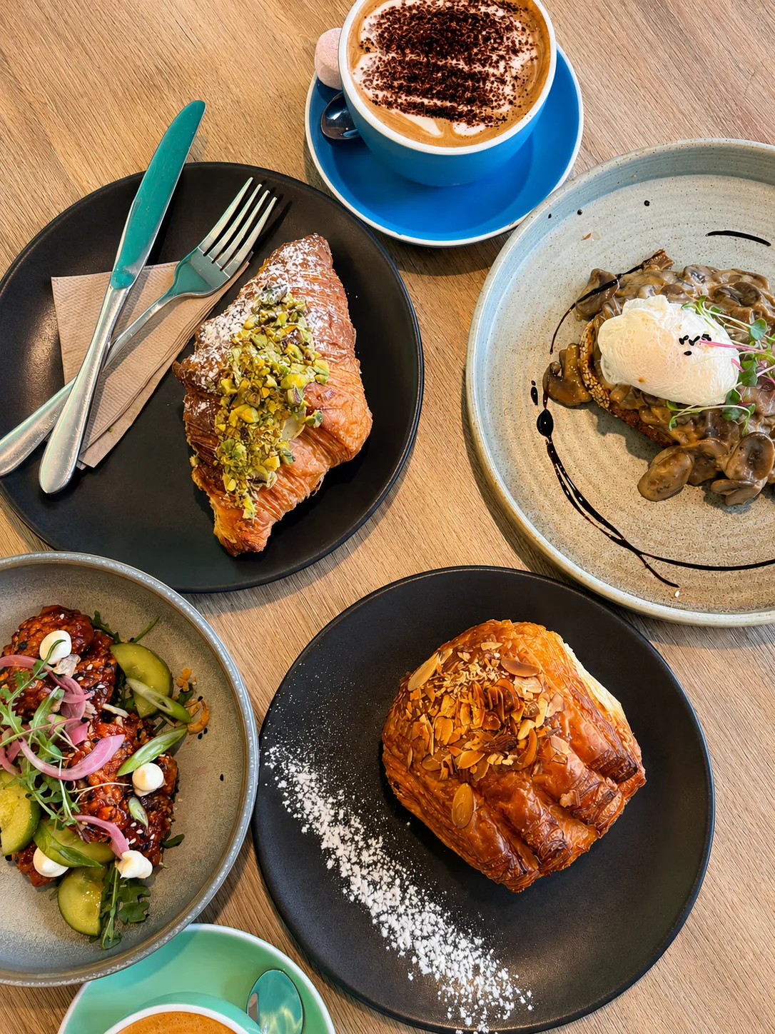 Pastries, coffee and brunch plates from above